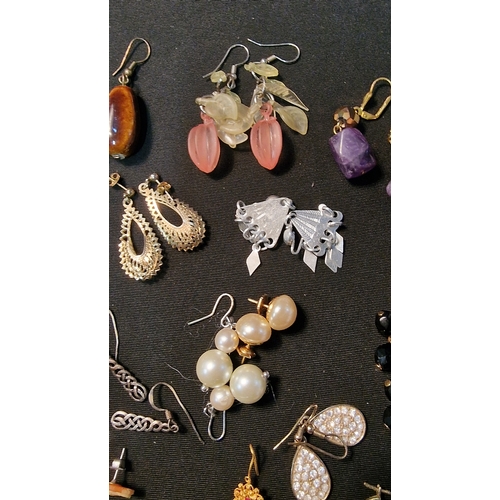 424 - Approximately 20 pairs of costume and sterling silver earings.