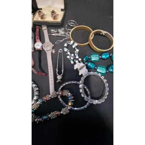 419 - A selection of costume jewellery includes vintage items.  Radley watch, bracelets, Stratton cuff lin... 