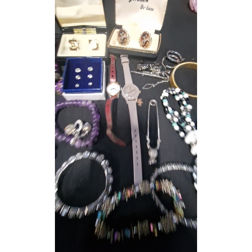 419 - A selection of costume jewellery includes vintage items.  Radley watch, bracelets, Stratton cuff lin... 