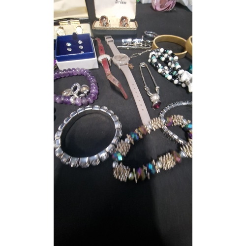 419 - A selection of costume jewellery includes vintage items.  Radley watch, bracelets, Stratton cuff lin... 