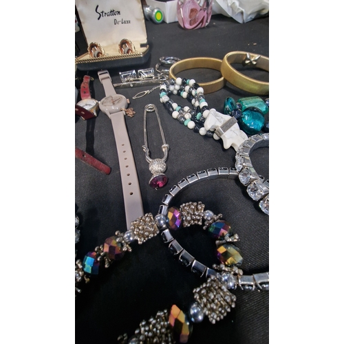 419 - A selection of costume jewellery includes vintage items.  Radley watch, bracelets, Stratton cuff lin... 