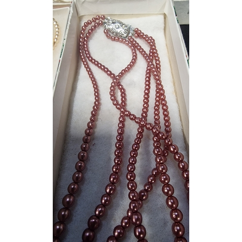 429 - A set of three vintage pearl necklaces along with an earing, bracelet and necklace set