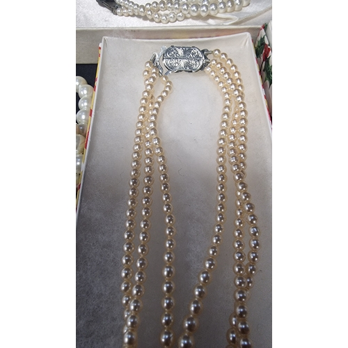 429 - A set of three vintage pearl necklaces along with an earing, bracelet and necklace set