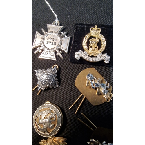 416 - Selection of cap badges and Pips.  Includes British Army honor Cross and a British Army Adjucant Gen... 