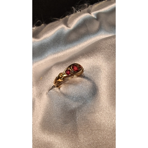 432 - Diamond and ruby 18ct 750 gold ring
Weight 2.1g approximately 
Size O