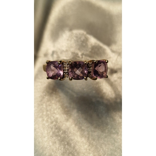 433 - 9ct 375 gold and three stone amethyst ring
Size U
Weight 2.73g approximately