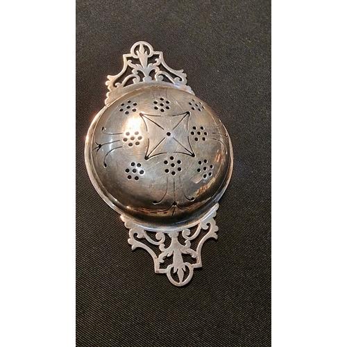 439 - Sterling silver tea strainer 
Weight 35.20g approximately