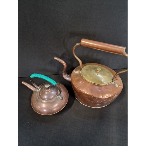 1 - Two brass and copper kettles.