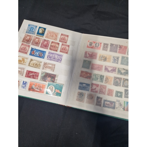 12 - A vintage stamp album containing Philippines stamps