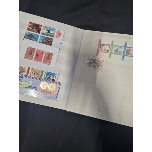 12 - A vintage stamp album containing Philippines stamps