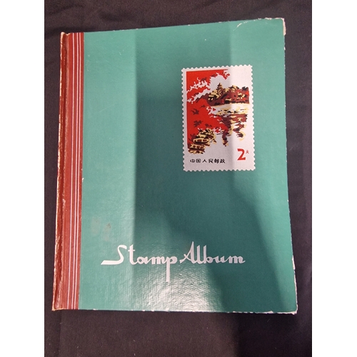 12 - A vintage stamp album containing Philippines stamps