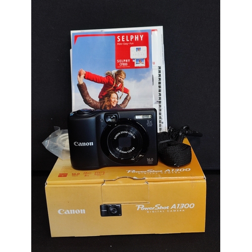 16 - Canon Powershot A1300 with box, manual, transfer wire and strap