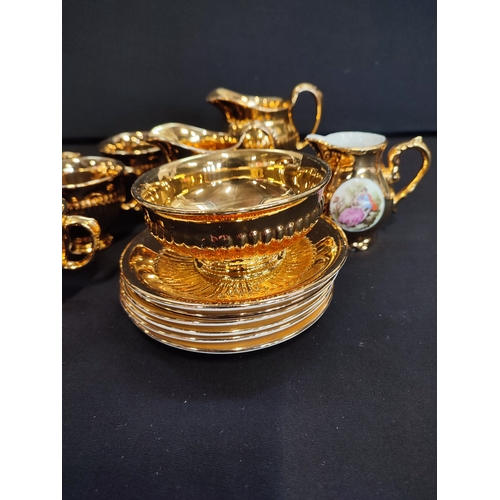 20 - Collection of Royal Winton Gold Coloured tea cups and saucers, plates and milk jugs