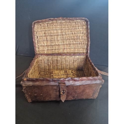 72 - A antique leather bound wicker picnic basket