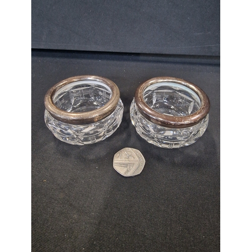 216 - Two lead crystal Open Salt Pots with sterling silver rim. 6.5 cm D x 4.5cm H approximately