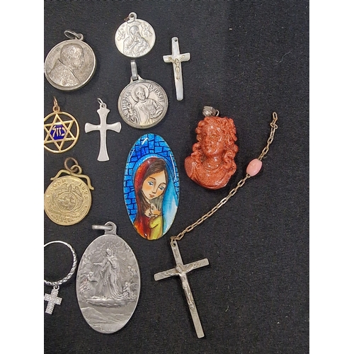 221 - A selection of vintage religious items.  Mainly pendants and other items