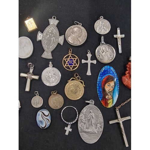 221 - A selection of vintage religious items.  Mainly pendants and other items