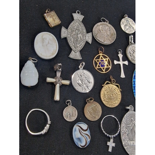 221 - A selection of vintage religious items.  Mainly pendants and other items