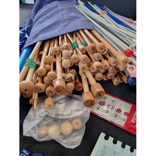 224 - A large collection of knitting needles of Various gauges, wooden and metal with accessories