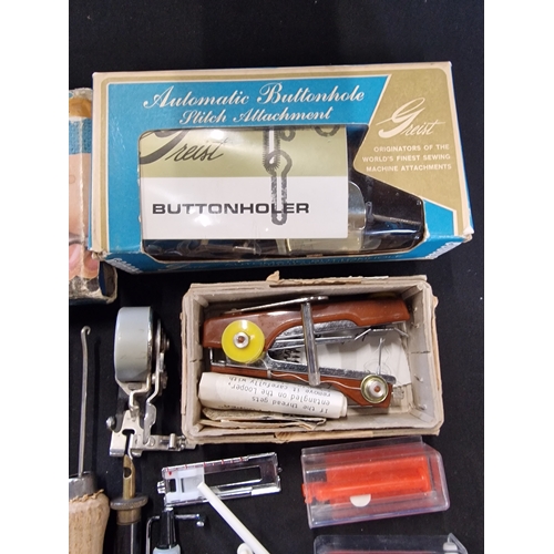 225 - A selection of sewing accessories. Includes The Netra - miracle sewing machine,  Buttoned, the 5 sec... 