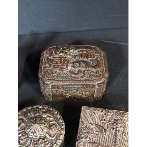 258 - Collection of oriental mixed metal trinket boxes and objects and a metal crucifix.