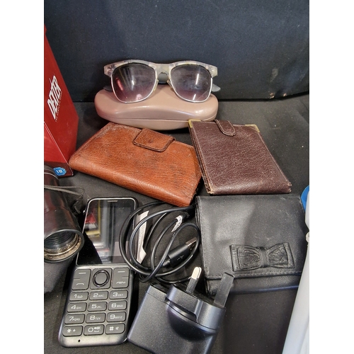 350 - A mixed collection of DVDS, mobile phone, leather wallets and purses, sun glasses, mini binoculars a... 