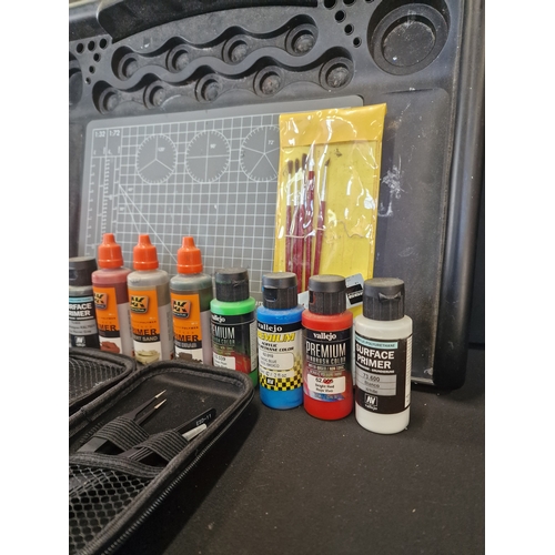 356 - A. Selection of AK interactive and Vallejo primers and surface primers with modeling tools and paint... 