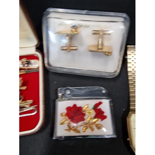 373 - A collection of mens Dress ware items.  Includes 24ct gold plated cuff links, watches, tie pins.