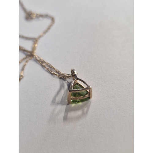 423 - 9ct gold chain with a green peridot stone