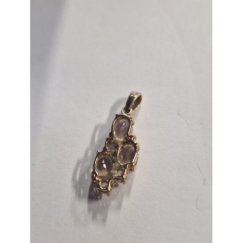 429 - 9ct gold pendant with diamonique stones