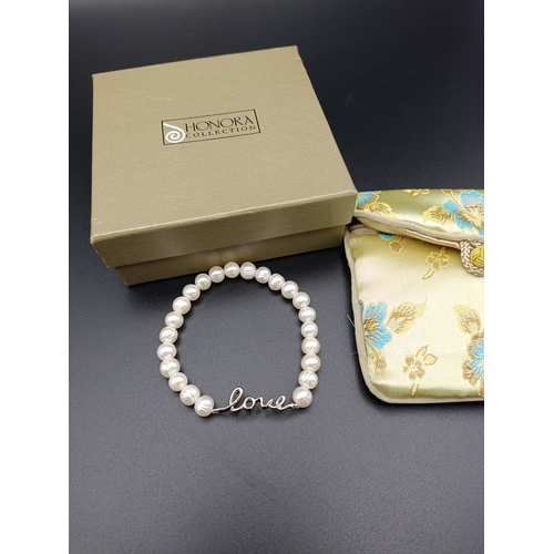 1 - Honora cultured pearl bracelet with Sterling silver closure. Comes with box and pouch.