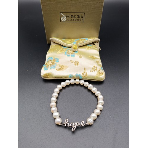 14 - Honora cultured pearl bracelet with sterling silver closure
Comes with box and pouch