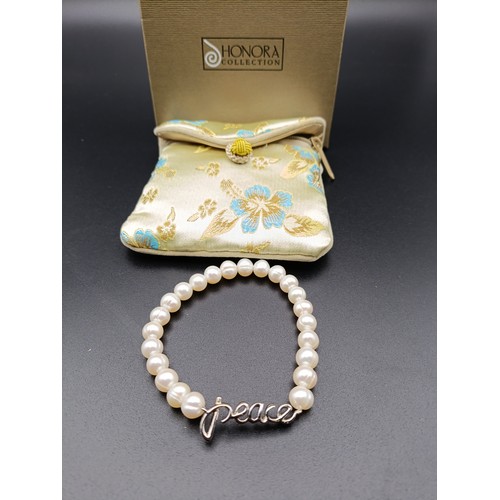 10 - Honora cultured pearl bracelet with sterling silver closure.  Comes with box and pouch.