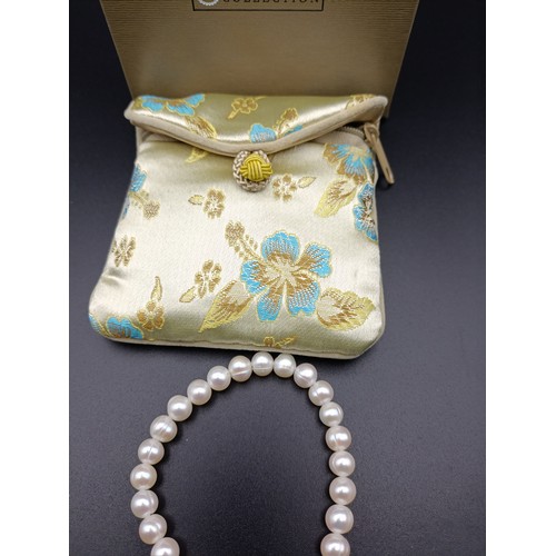 10 - Honora cultured pearl bracelet with sterling silver closure.  Comes with box and pouch.