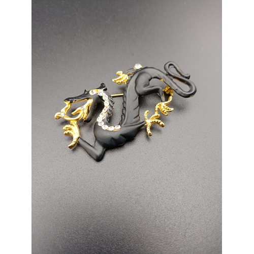 17 - Beautiful Swarovski dragon brooch.  In matt black with gold detail claws and silver detail to neckli... 