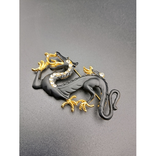 17 - Beautiful Swarovski dragon brooch.  In matt black with gold detail claws and silver detail to neckli... 