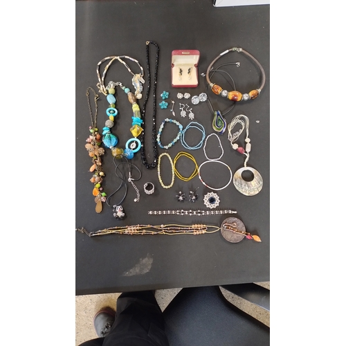 49 - Bag of costume jewellery including necklaces, earrings and other items