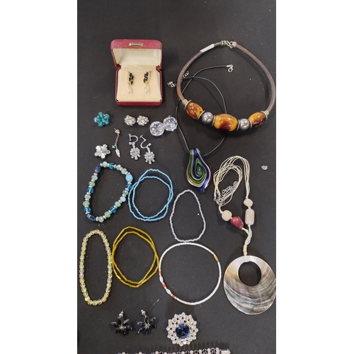49 - Bag of costume jewellery including necklaces, earrings and other items