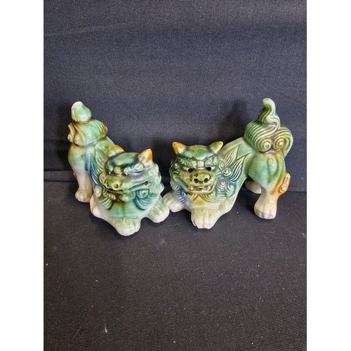 71 - A pair of vintage Chinese ceramic foo dogs 
Approximately 10cm L x 9.5cm H max.