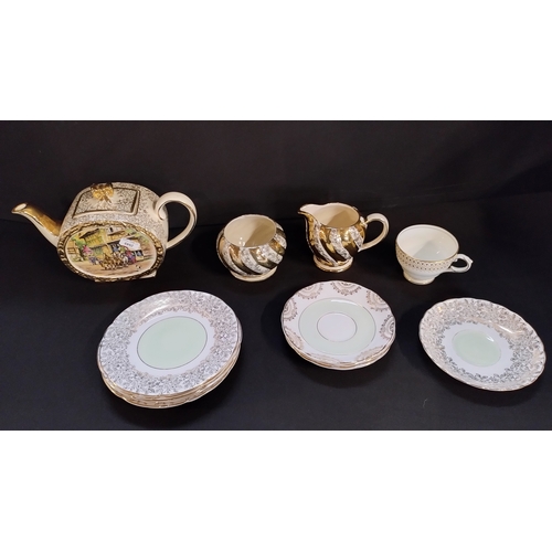 95 - 22 CT gold inlaid tea set, teapot,1 cup, milk jug, sugar bowl and plates and saucers,