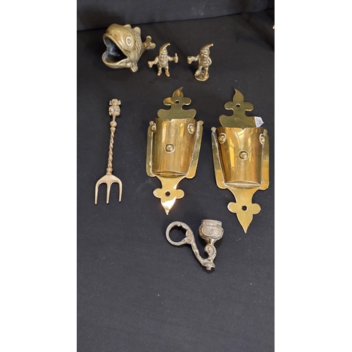 110 - Selection of vintage brasses includes a pair of brass wall sconce's, etched trinket bowls , leprecha... 