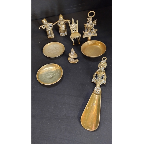 110 - Selection of vintage brasses includes a pair of brass wall sconce's, etched trinket bowls , leprecha... 