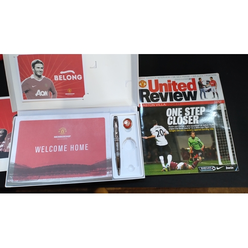112 - Manchester United football club memorabilia. 
 Including dressing gown age 11/12, book, DVD, members... 