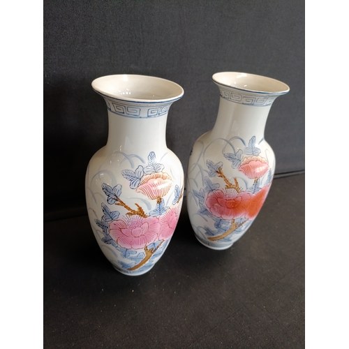 133 - Pair of oriental floral vases approx. 21cm tall