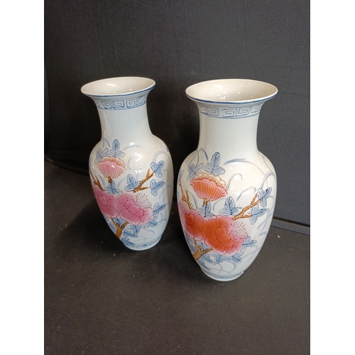 133 - Pair of oriental floral vases approx. 21cm tall