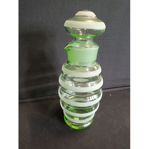 134 - Vintage art deco green glass lidded water jug with sugar frosted bands. Approximately 25cm H