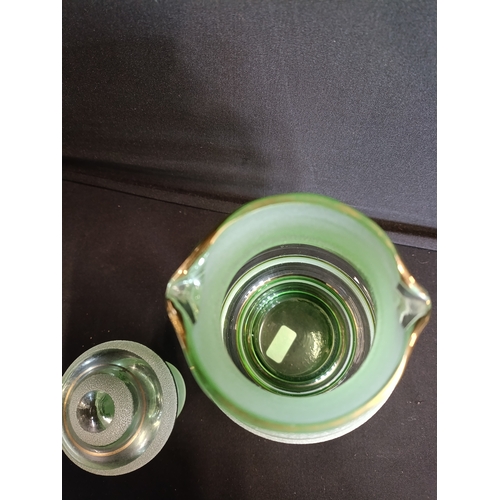 134 - Vintage art deco green glass lidded water jug with sugar frosted bands. Approximately 25cm H