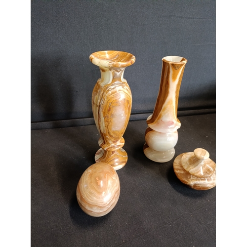 137 - Collection of Onyx items including small vases approximately 15cm tall, an egg and a lidded trinket ... 