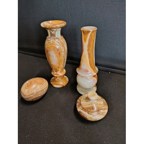 137 - Collection of Onyx items including small vases approximately 15cm tall, an egg and a lidded trinket ... 