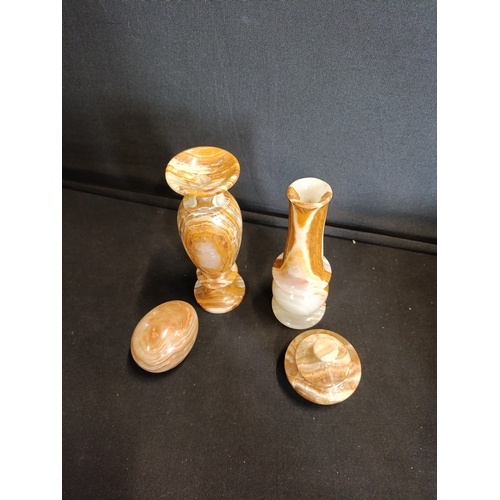 137 - Collection of Onyx items including small vases approximately 15cm tall, an egg and a lidded trinket ... 